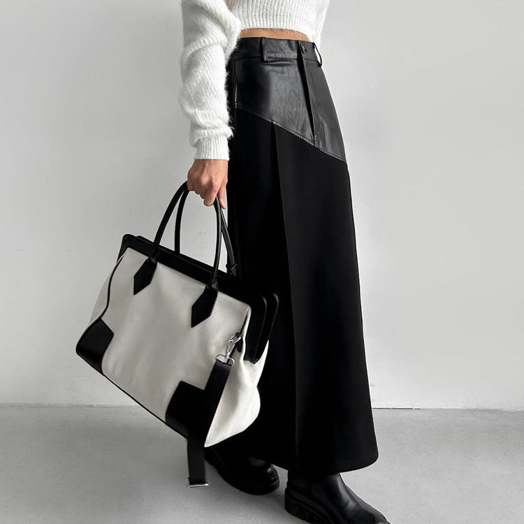 Falda de mujer estilo retro con costuras de piel sintética y largo medio, cintura alta y abertura en la cadera.