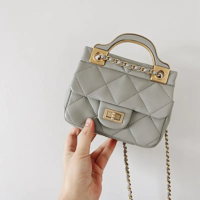 Bolso bandolera de piel de oveja con cadena de rombos