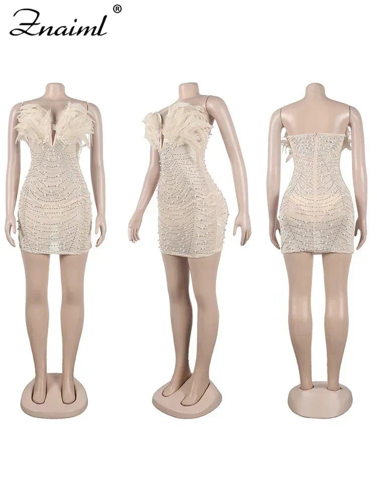 Vestido transparente con diamantes de imitación y plumas sexys de Znaiml