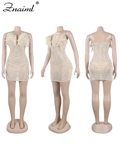 Vestido transparente con diamantes de imitación y plumas sexys de Znaiml