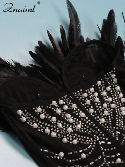 Vestido transparente con diamantes de imitación y plumas sexys de Znaiml