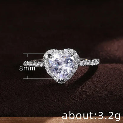 Anillo de corazón de melocotón europeo y americano para mujer, personalizado, con forma de corazón, circón con incrustaciones de diamantes, joyería de moda al por mayor, 2025