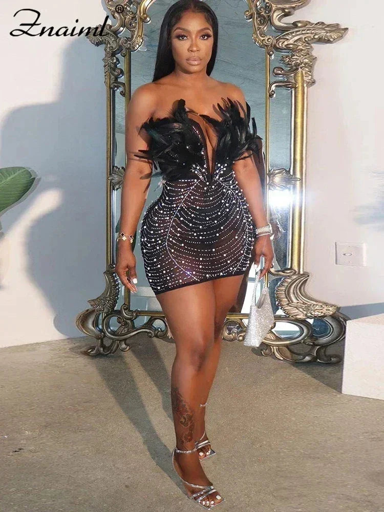 Vestido transparente con diamantes de imitación y plumas sexys de Znaiml