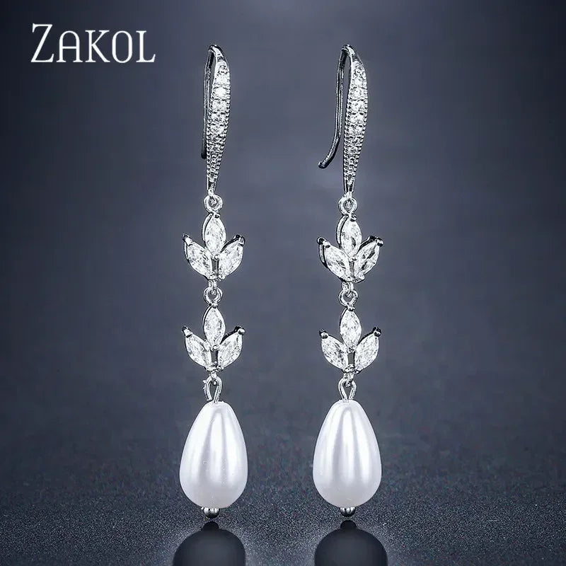Pendientes colgantes de perlas de imitación redondas ZAKOL para mujer, con circonitas brillantes y hojas de cristal, largos, para novia, joyería de boda
