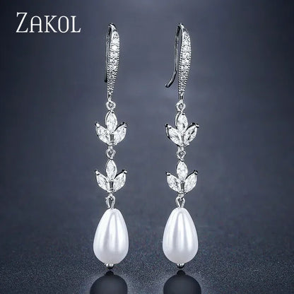 Pendientes colgantes de perlas de imitación redondas ZAKOL para mujer, con circonitas brillantes y hojas de cristal, largos, para novia, joyería de boda