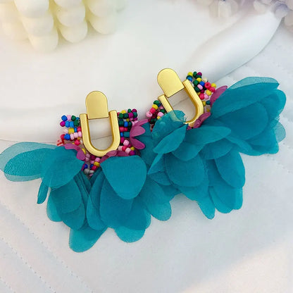 Pendientes largos con borlas de algodón hechos a mano