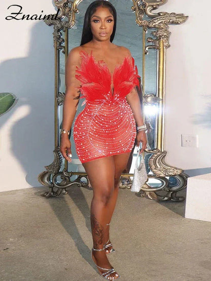 Vestido transparente con diamantes de imitación y plumas sexys de Znaiml
