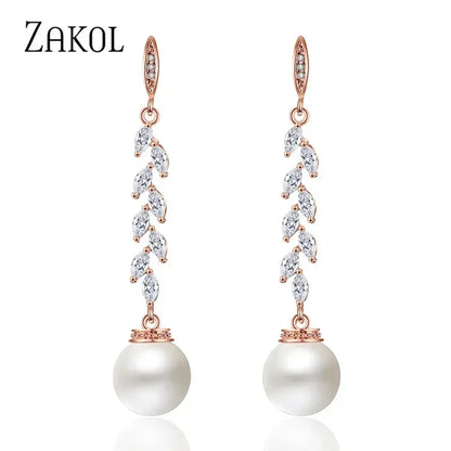 Pendientes colgantes de perlas de imitación redondas ZAKOL para mujer, con circonitas brillantes y hojas de cristal, largos, para novia, joyería de boda