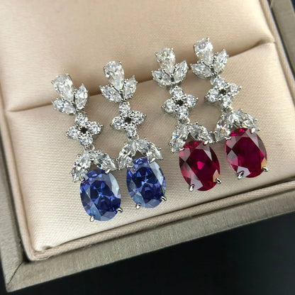 Pendientes colgantes para mujer con corte marquesa y pavé ovalado de moissanita de 1,5 ct y platino PT950. Elaborados en platino PT950 con doble forma: marquesa y ovalada.