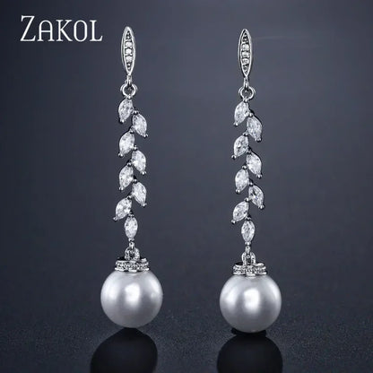 Pendientes colgantes de perlas de imitación redondas ZAKOL para mujer, con circonitas brillantes y hojas de cristal, largos, para novia, joyería de boda
