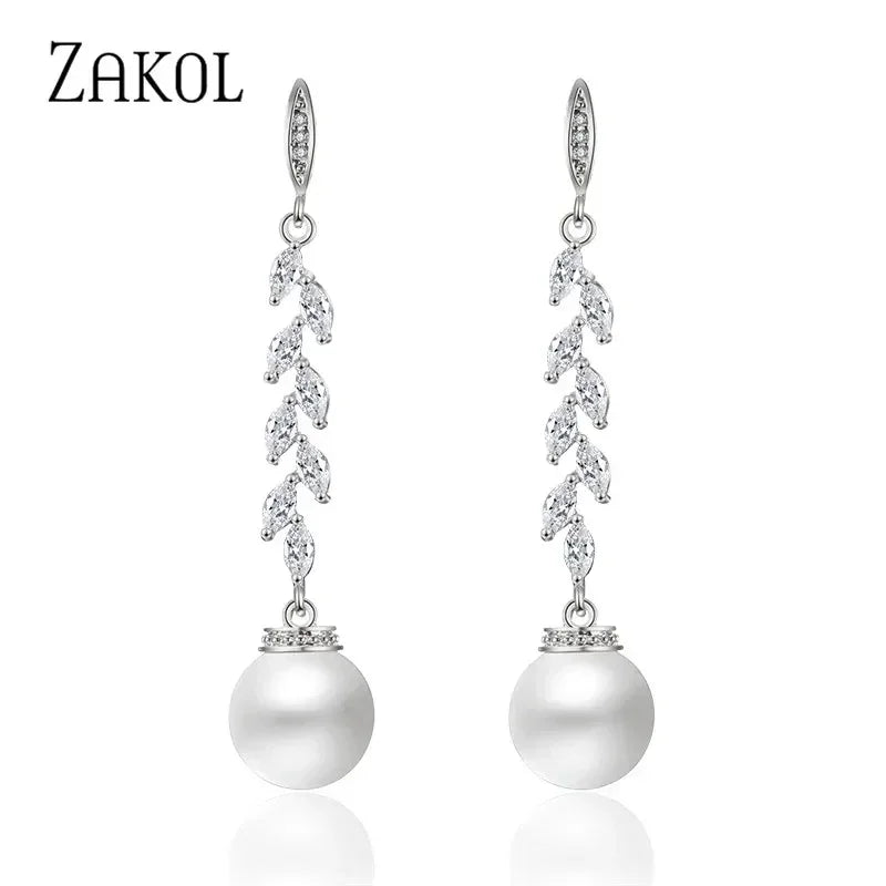 Pendientes colgantes de perlas de imitación redondas ZAKOL para mujer, con circonitas brillantes y hojas de cristal, largos, para novia, joyería de boda