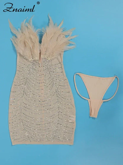 Vestido transparente con diamantes de imitación y plumas sexys de Znaiml