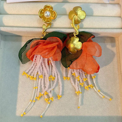 Pendientes largos con borlas de algodón hechos a mano