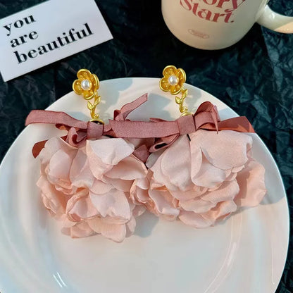 Pendientes largos con borlas de algodón hechos a mano