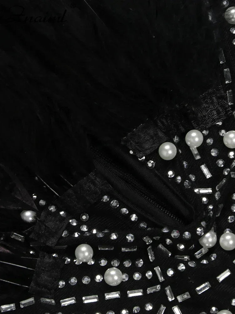 Vestido transparente con diamantes de imitación y plumas sexys de Znaiml