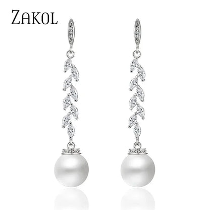 Pendientes colgantes de perlas de imitación redondas ZAKOL para mujer, con circonitas brillantes y hojas de cristal, largos, para novia, joyería de boda