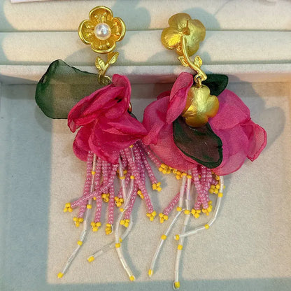 Pendientes largos con borlas de algodón hechos a mano