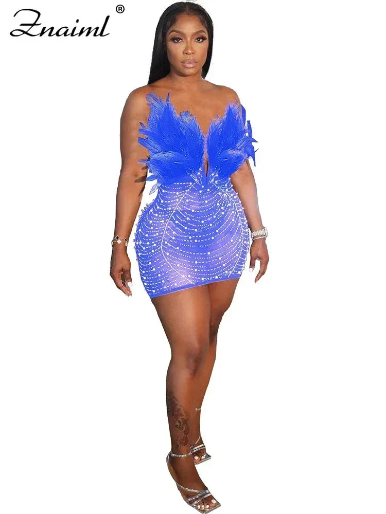 Vestido transparente con diamantes de imitación y plumas sexys de Znaiml