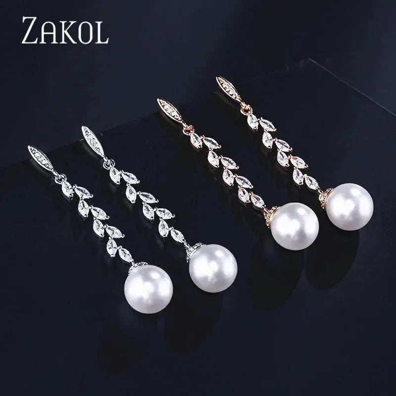 Pendientes colgantes de perlas de imitación redondas ZAKOL para mujer, con circonitas brillantes y hojas de cristal, largos, para novia, joyería de boda
